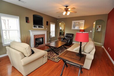 The great room showcases gleaming hardwood floor a