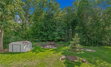 Private backyard with storage shed.
