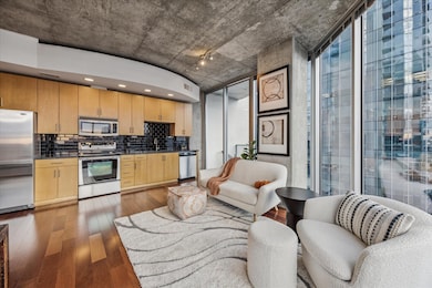Kitchen featuring dark wood finished floors, appl