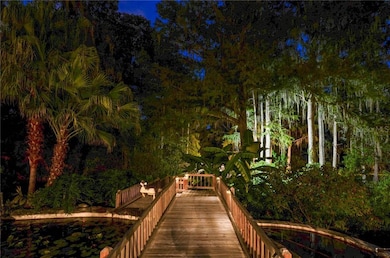 Twilight view of deck leading down to river fronta