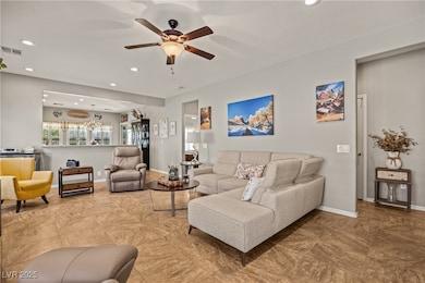 Living room featuring baseboards, visible vents, a