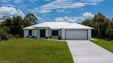 View of front of property featuring a garage and a