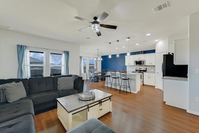 Living room with recessed lighting, visible vents