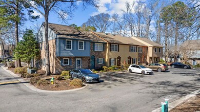 View of front of property with brick siding and un