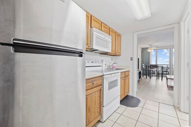 Kitchen with light tile patterned flooring, sink, 