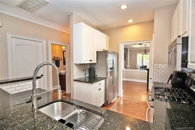 Upgraded kitchen with granite, subway tile backspl
