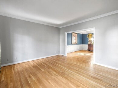 Formal living room with crown molding