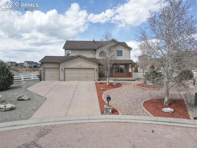 Front of property with a porch and a garage