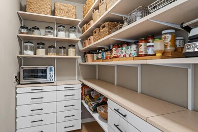 Walk-In Pantry – Extra storage to keep everything organized and out of sight - unique to this home ONLY