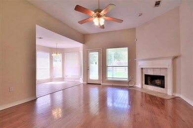 Living Room with Fireplace with the Dining Area to