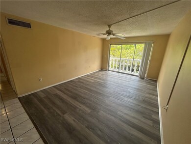 Spare room with a ceiling fan, wood finished floor