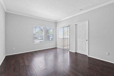 Unfurnished bedroom with crown molding, a texture