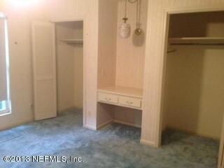 Bedroom with built in desk