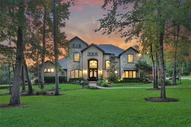Sophisticated home with a Texas Hill Country construction created by stacked stone walls and a touch of Mediterranean style surrounded by lush green nature.