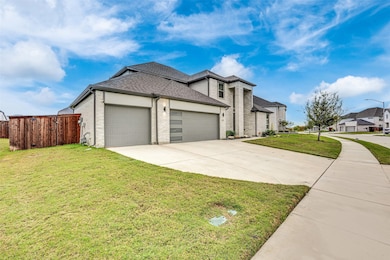 View of front of house with brick siding, an attached garage, concrete driveway, a shingled roof, and a residential view