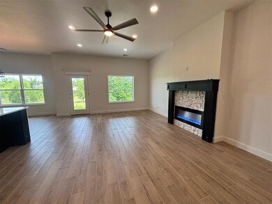Entry into living room with electric fireplace
