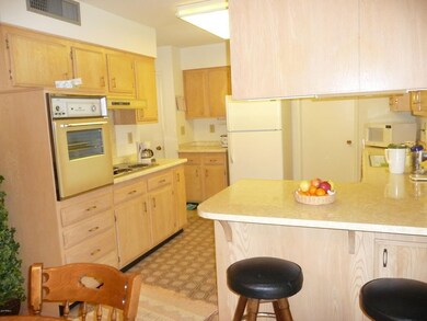 Kitchen view w/barstools