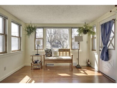 The sun room welcomes you with walls of windows fo