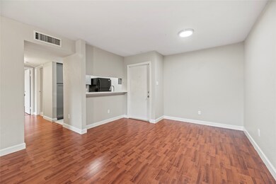 The cozy living room offers easy care flooring and
