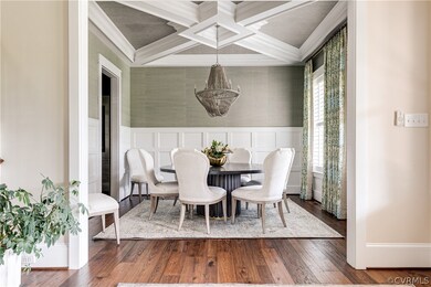 An elegant formal dining room has tons of trim det