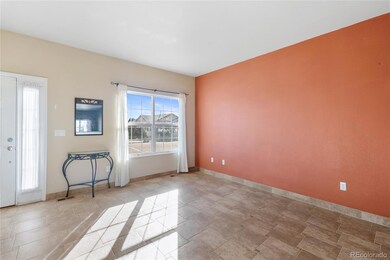 Front family room with tile floors and accent wall