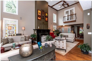 SUNLIGHT FLOODS THE 18 FOOT CEILING ROOMS AND THE 