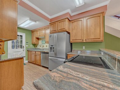Kitchen features granite and stainless appliances
