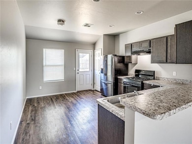 Kitchen featuring visible vents, stainless steel r