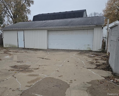 Garage with concrete driveway