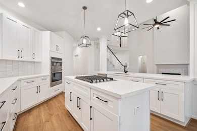 NEW QUARTZ COUNTERTOP, MODERN NEW BACKSPLASH, NEW: CABINETS, GAS RANGE, OVEN, MICROWAVE AND DISHWASHER!