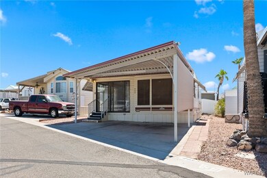 View of front of home featuring a carport
