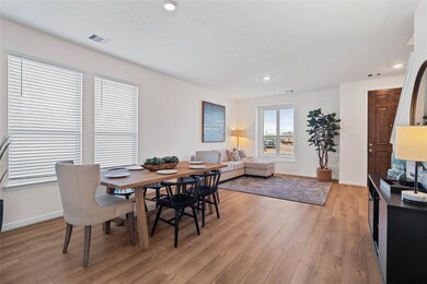 This formal dining area features high ceilings, re
