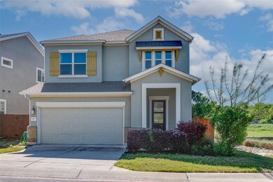 View of front of home with a garage, stucco sidin