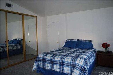 Master bedroom with full wall closet and walk-in c