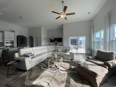 Living Room with Open Concept featuring a Vaulted 