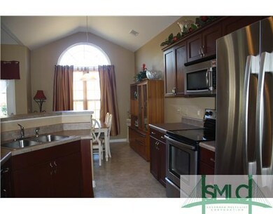 Kitchen. Kitchen has a breakfast bar, recessed lig