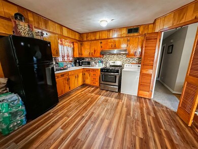 Kitchen featuring washer / clothes dryer, tasteful