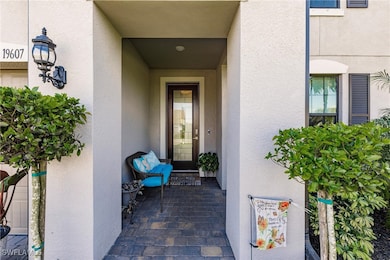Property entrance featuring stucco siding