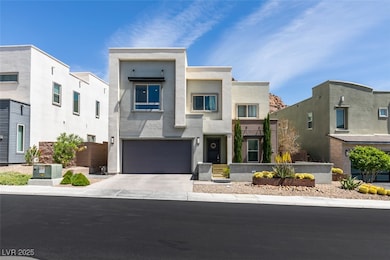 Modern home featuring concrete driveway, stucco siding, and an attached garage