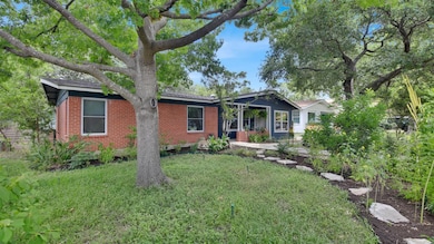 Single story home featuring brick siding and a fr