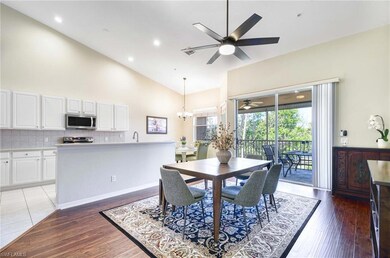 Dining area featuring ceiling fan, high vaulted ce