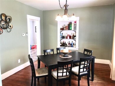 Large dining room with built in shelves opens up t