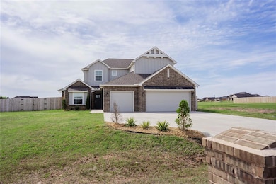 Craftsman-style house with fence, brick siding, co