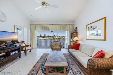 Living room with light tile patterned floors, high