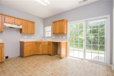 Kitchen conveniently opens to patio in back.  Sell