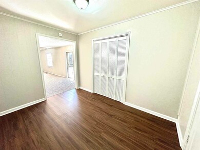 Unfurnished bedroom featuring a closet, baseboards