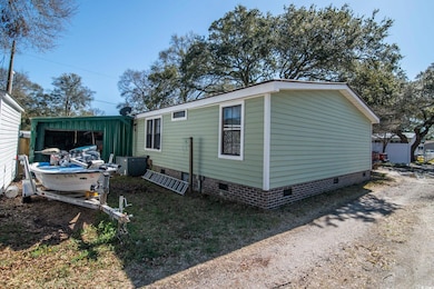 Exterior space featuring crawl space, an outbuildi