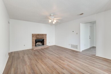 Unfurnished living room with ceiling fan, light w