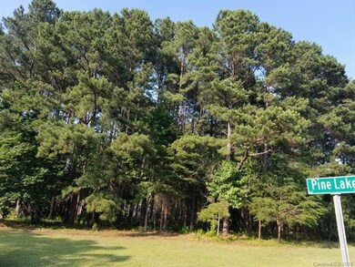 This beautiful lot with mature trees sits on the c