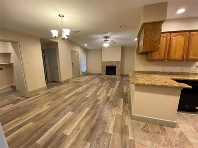 Kitchen with light hardwood / wood-style floors, a